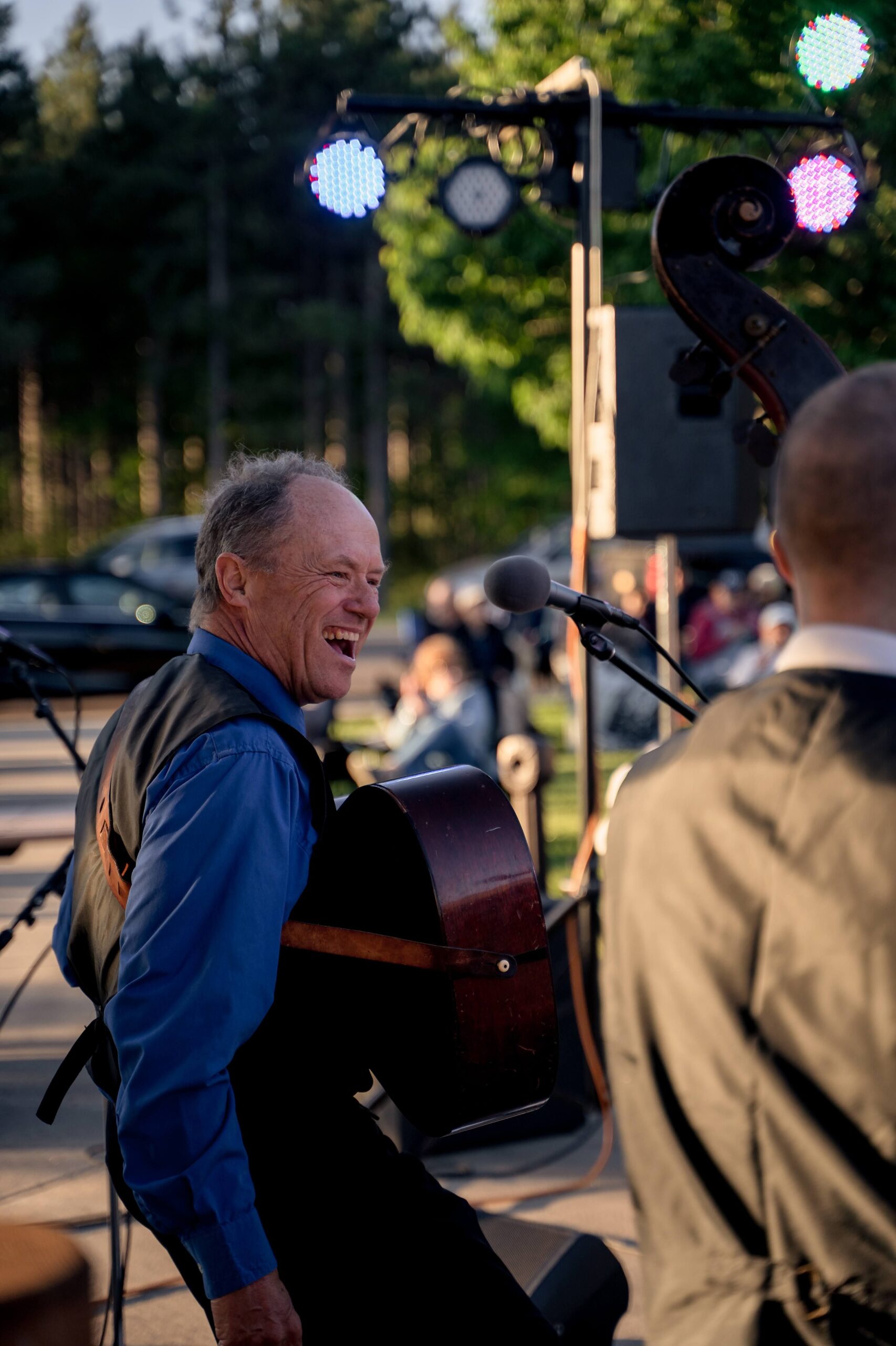 Musician performing live at an outdoor event
