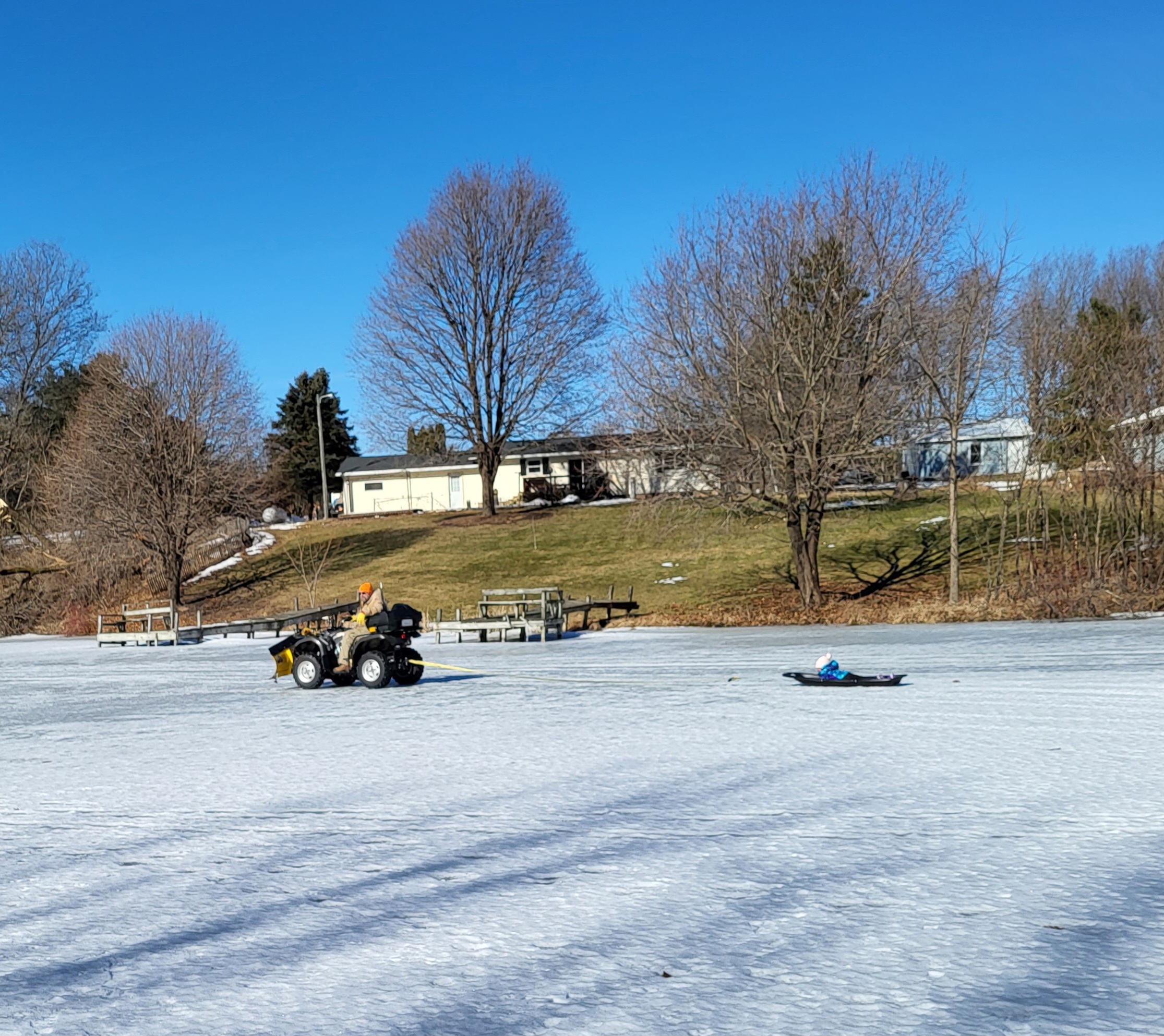 Frozen pond sledding
