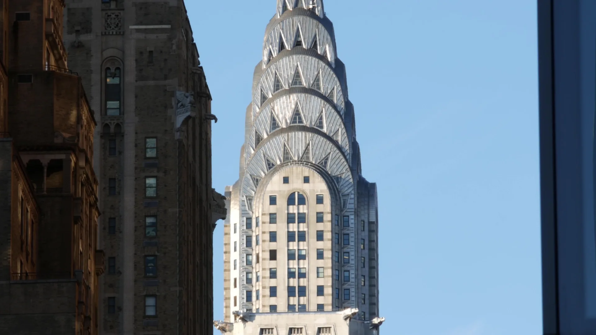 New York City, United States of America - 9 Sept 2024: Manhattan Midtown. Skyscraper tower architecture. Chrysler building on 42 street. Lexington avenue in Turtle Bay. Urban cityscape, red brick.