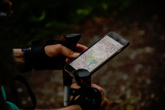 A traveller consulting a map on a handheld screen
