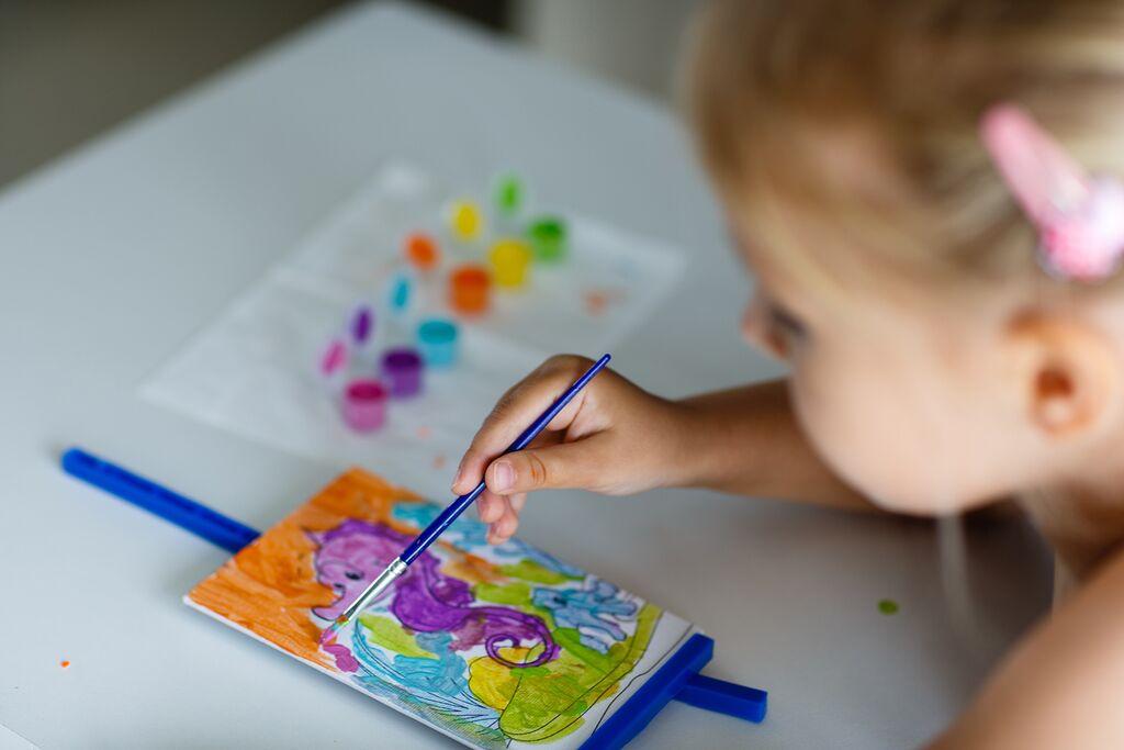 Markers And An Open Blank Drawing Pad Bright Colored Pencils Are Lying On  The Table Next To Him Childrens Creativity Hobbies School And Preschool  Education Drawing Lessons Back To School High-Res Stock