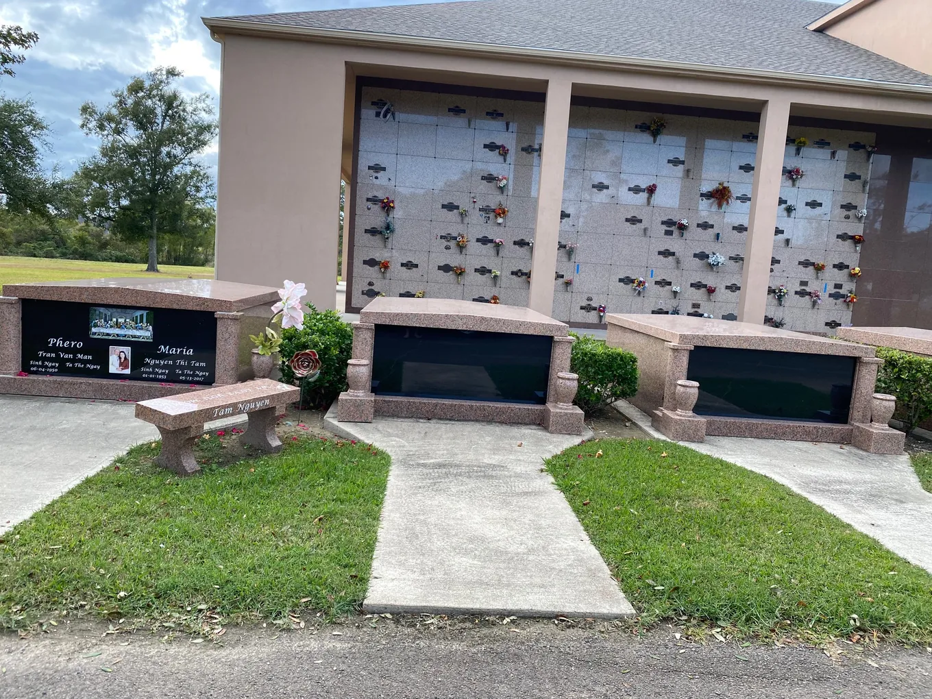 Pink granite columbarium building with companion crypts at Oak Bluff Memorial Park