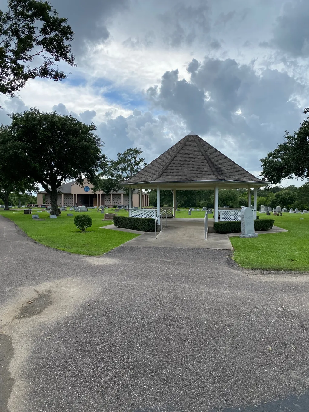 White garden pavilion on the grounds at Oak Bluff Memorial Park