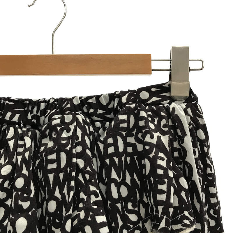 COMME des GARCONS / コムデギャルソン ポリエステル総英字プリント イージースカート