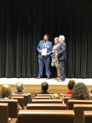 Lachlan receiving his Augustus Alt Prize from NSW Surveyor General Narelle Underwood