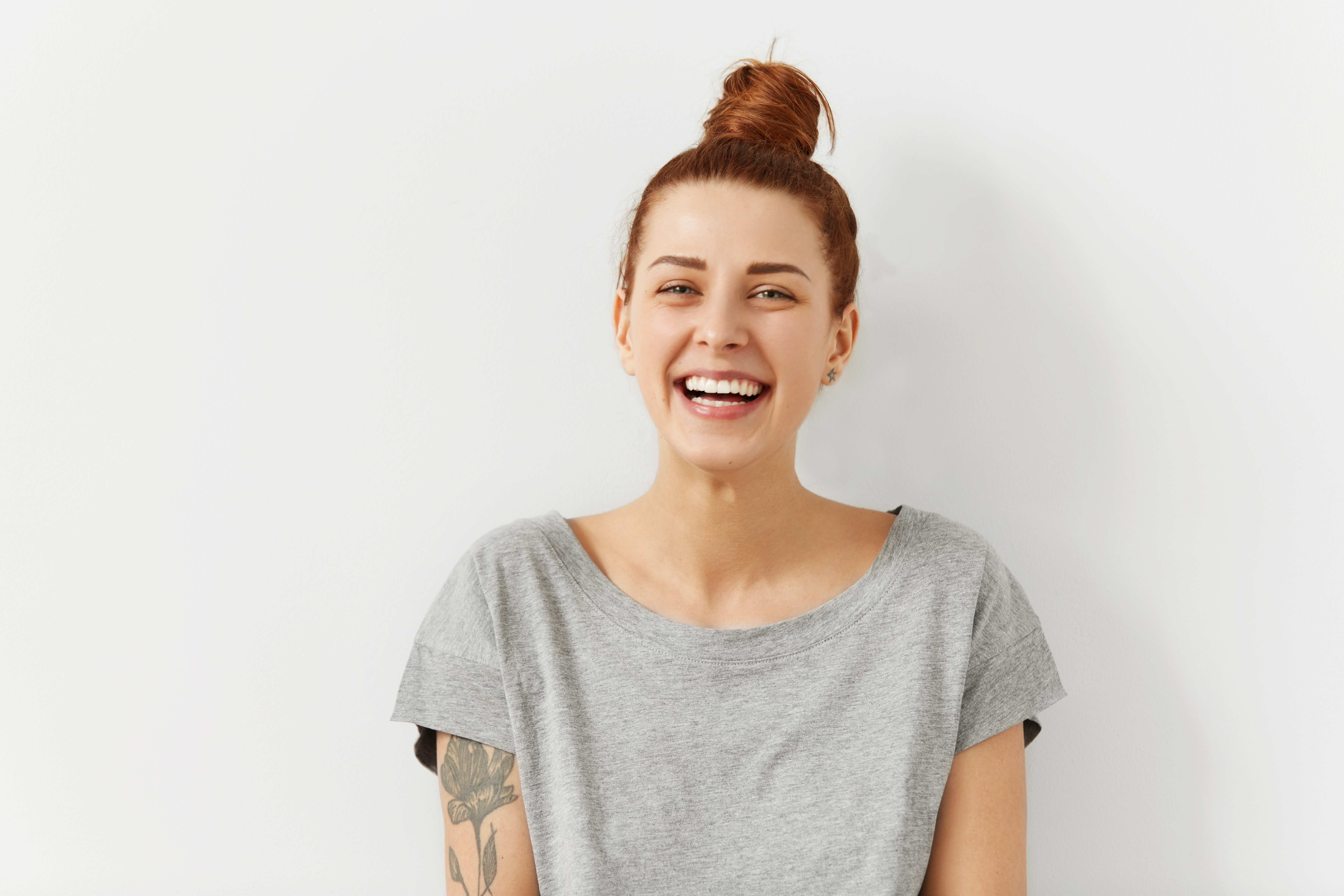 Man smiling with a laptop