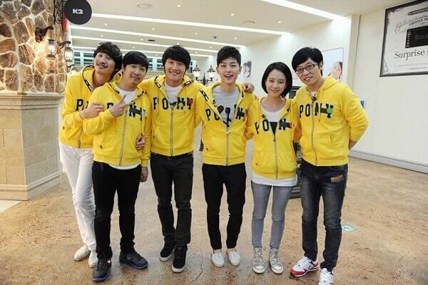 Song Joong-Ki wearing a yellow hoodie and a black pant