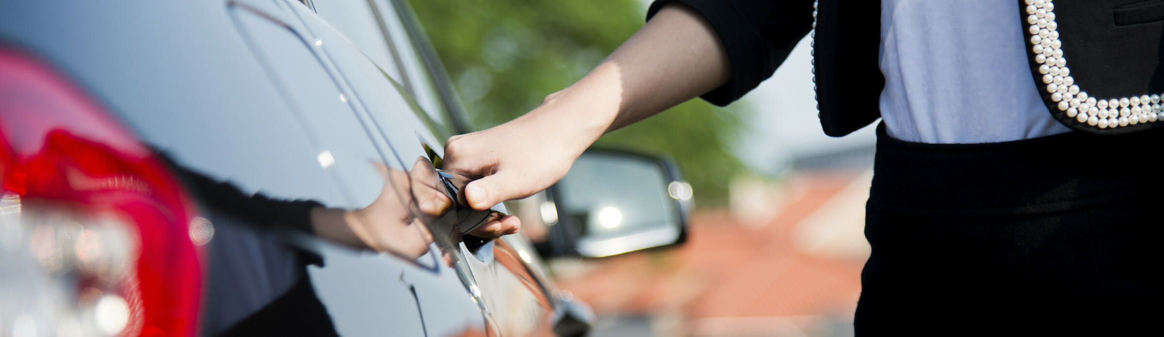 Woman getting into her car