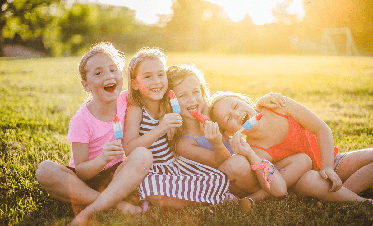 Kids enjoying ice blocks at the park