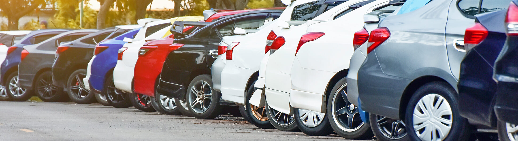 A row of cars in the parking lot