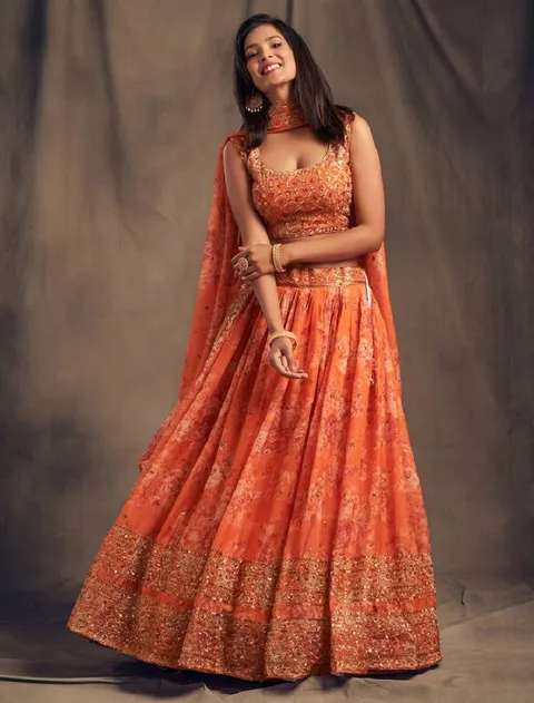 Orange organza lehenga choli with embroidery zari work