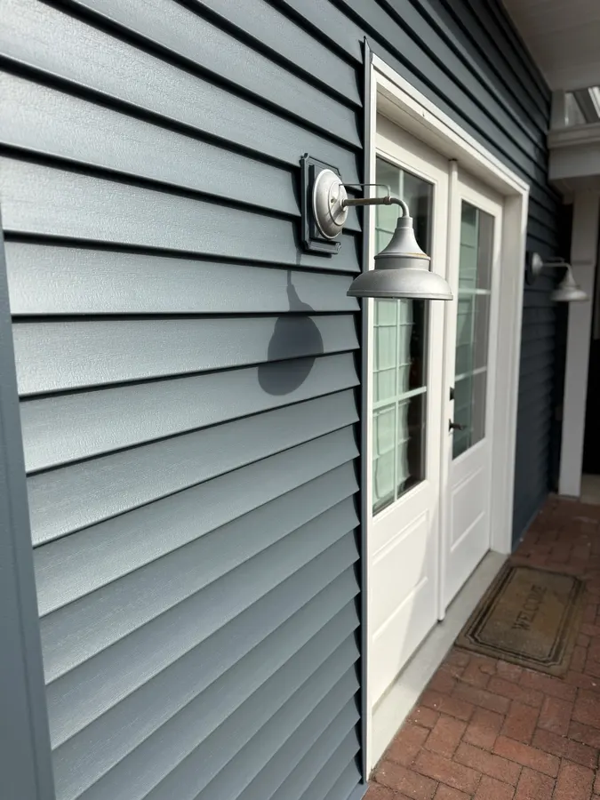 Close-up detail of blue siding installation