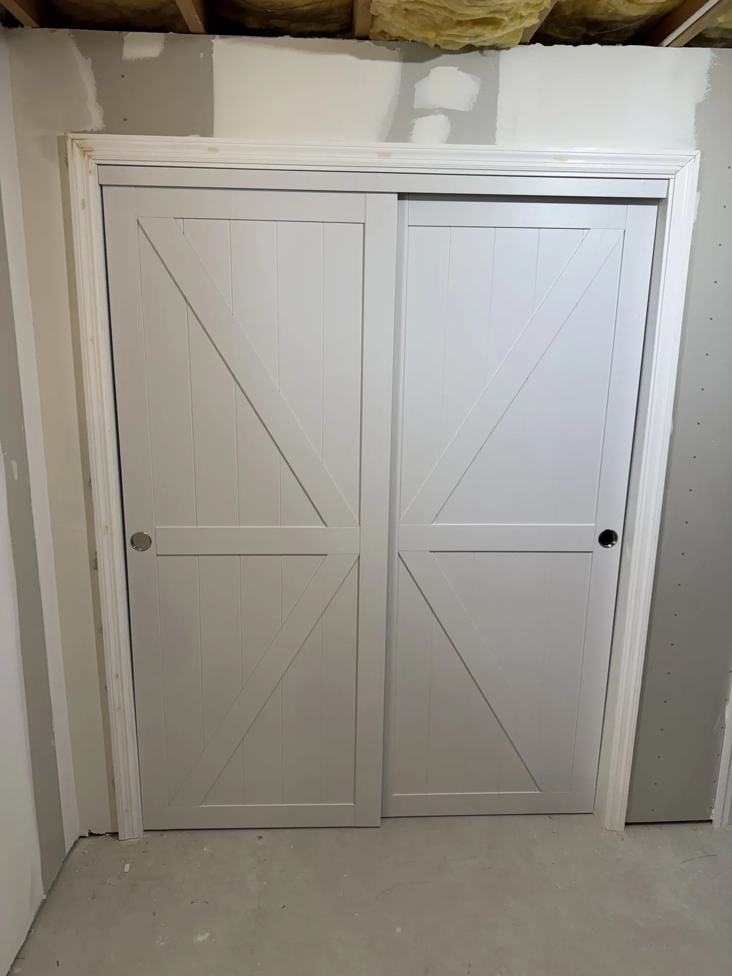 Barn style sliding doors in finished basement