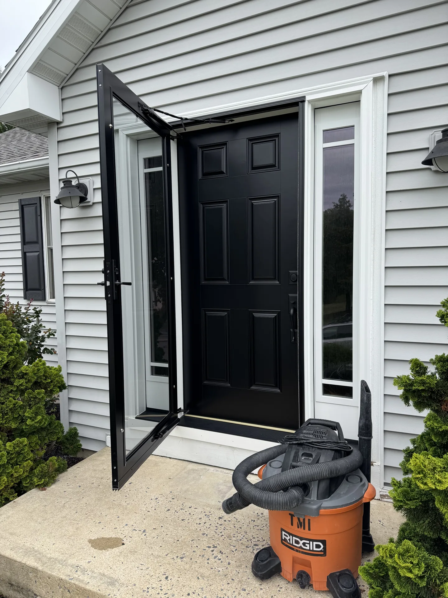 New black entry door with matching storm door