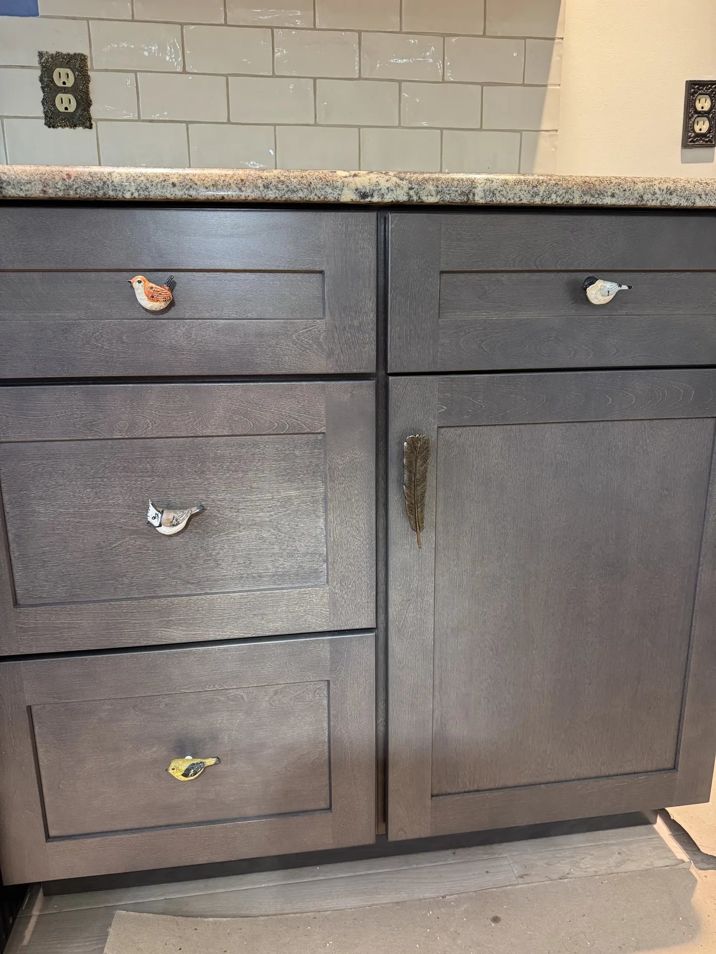 Kitchen cabinets being installed