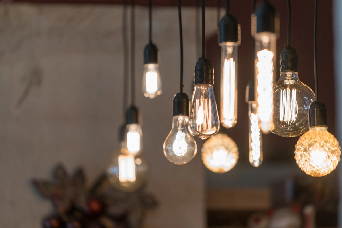 Vintage pendant bulbs glowing in a home