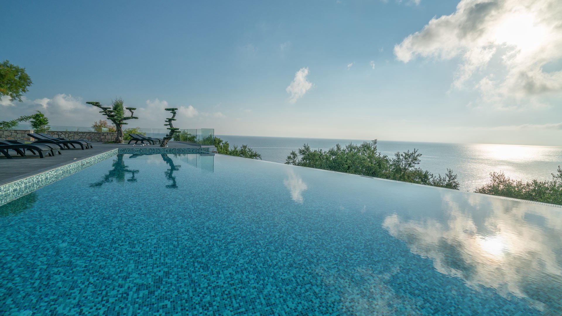 The infinity pool merging with the Ionian Sea at Kymothoe Elite Suites in Zakynthos