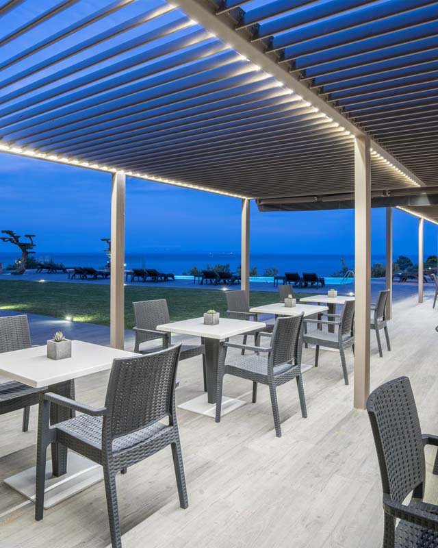 The snack bar and pool at night in Kymothoe Elite Suites at Zakynthos