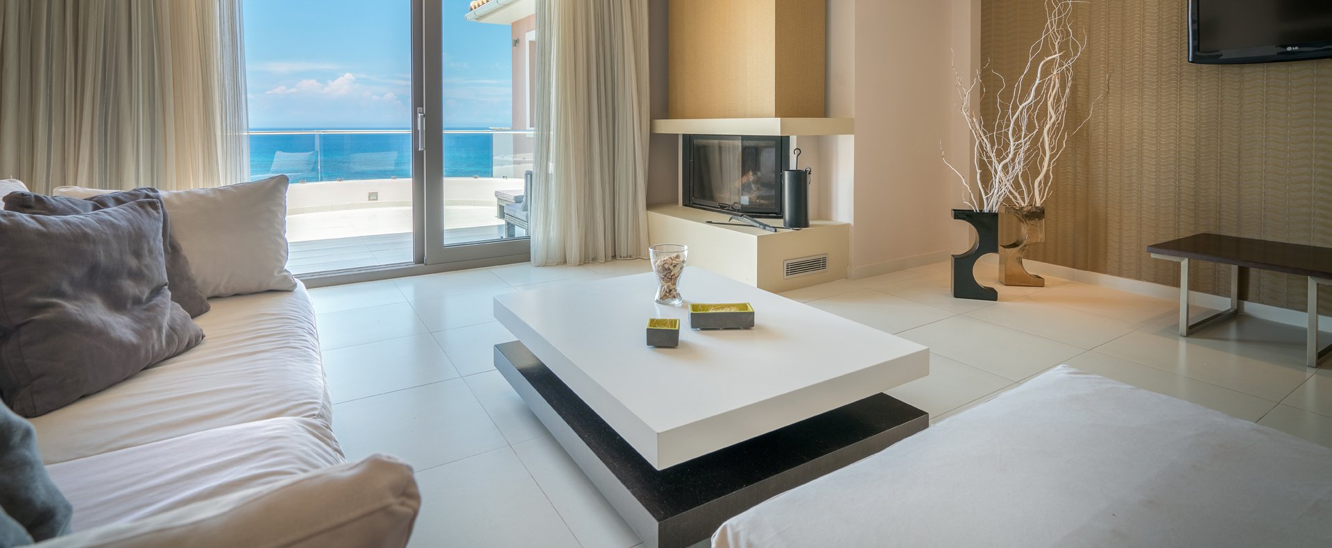 The cozy living room with a sea view that Kymothoe Elite Suites offers in Zakynthos