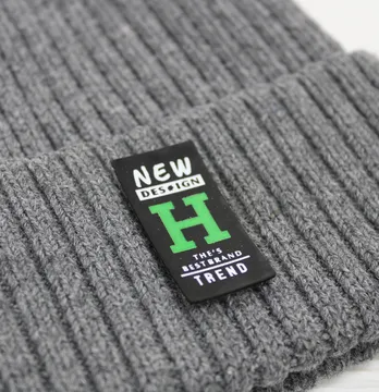 Нашивка "New design" 20*40 мм чорного кольору з зеленим малюнком