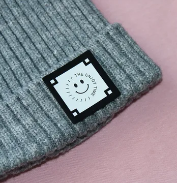 Нашивка "The enjoy time"  35*35 мм чорна з білим нанесенням