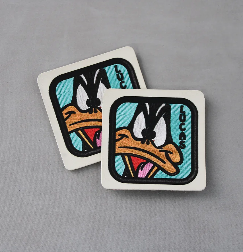 Нашивка "Lucas" на блакитному 40*40 мм молочна основа-1