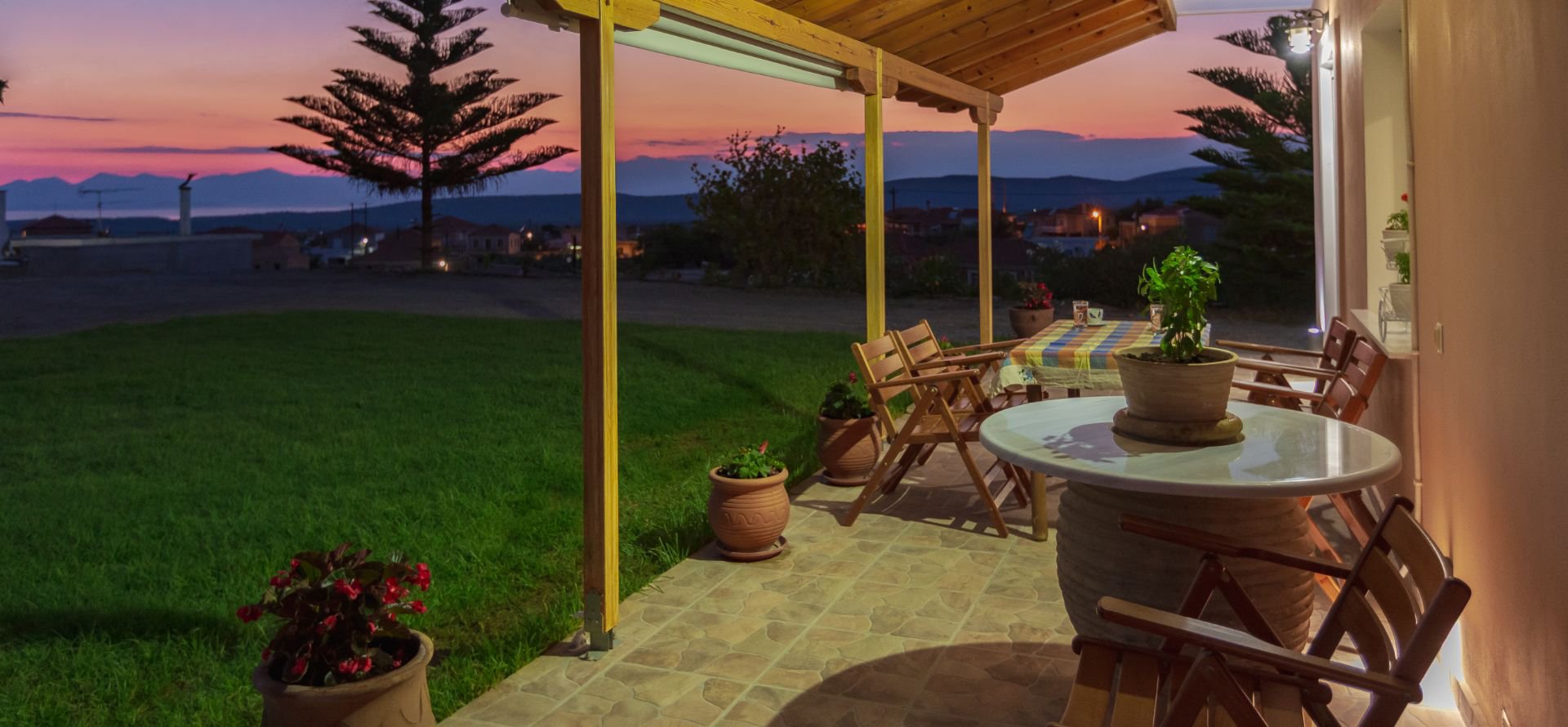 The garden view from the outdoor dining area of Laconia Domus