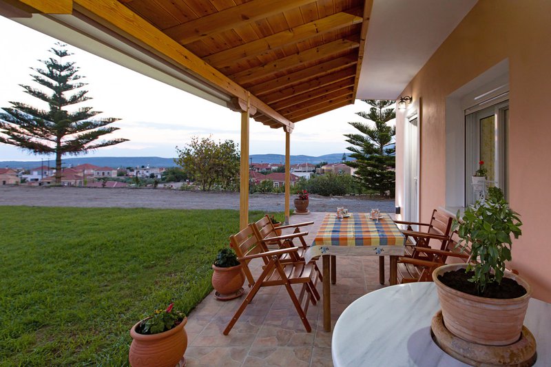 The garden view from the outdoor dining area of Laconia Domus