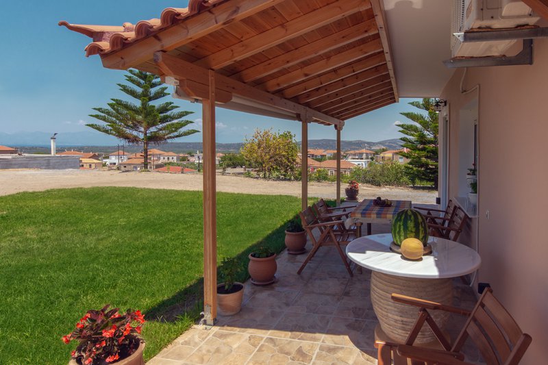 The garden view from the outdoor dining area of Laconia Domus