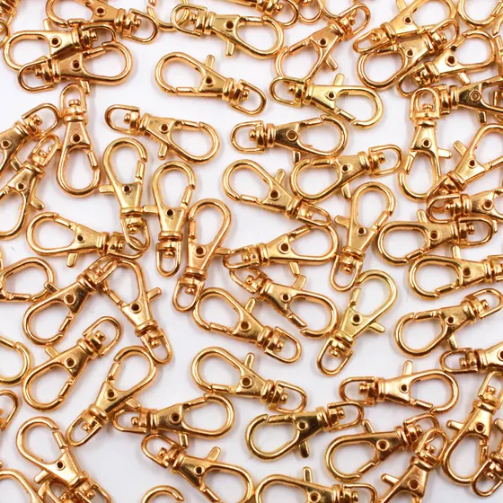 Fecho Mosquetao Base Arredondada 23Mm Em Zamak (100 Pc) - Dourado