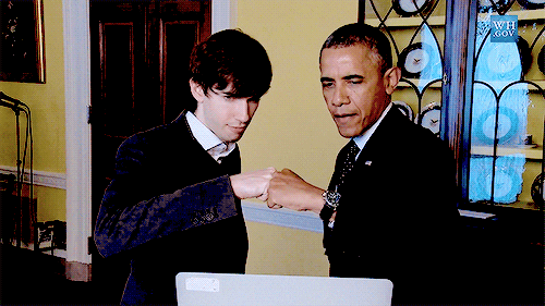 obama and student hand shake 