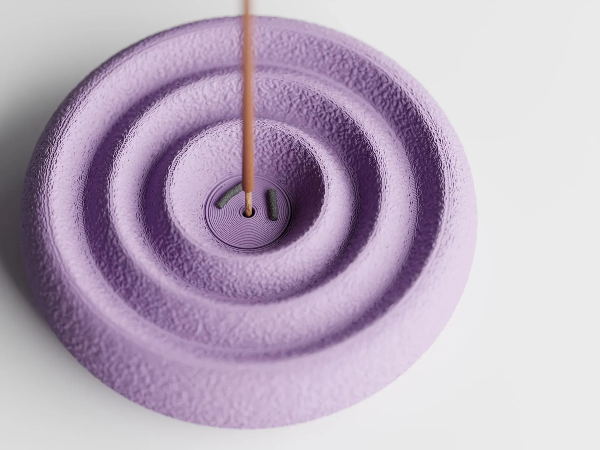 Onda Incense Stick Holder in Lilac Purple — top-down view of the concentric fuzzy-skin grooves with an incense stick in the centre