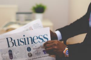 Entrepreneur reading a business newspaper