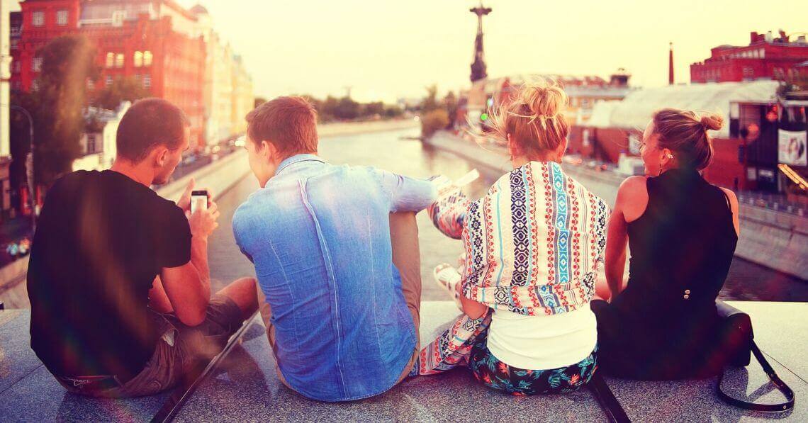 Friends talking on a bridge