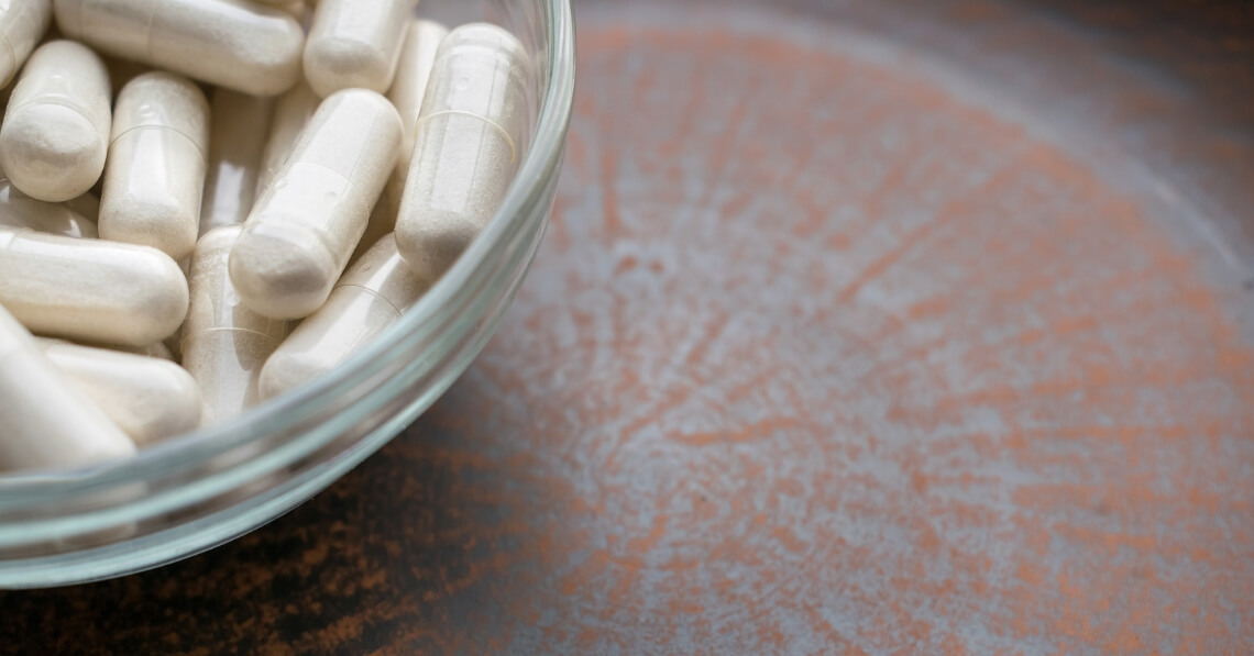 Supplement capsules in a bowl