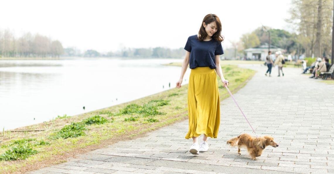 A woman walking her dog