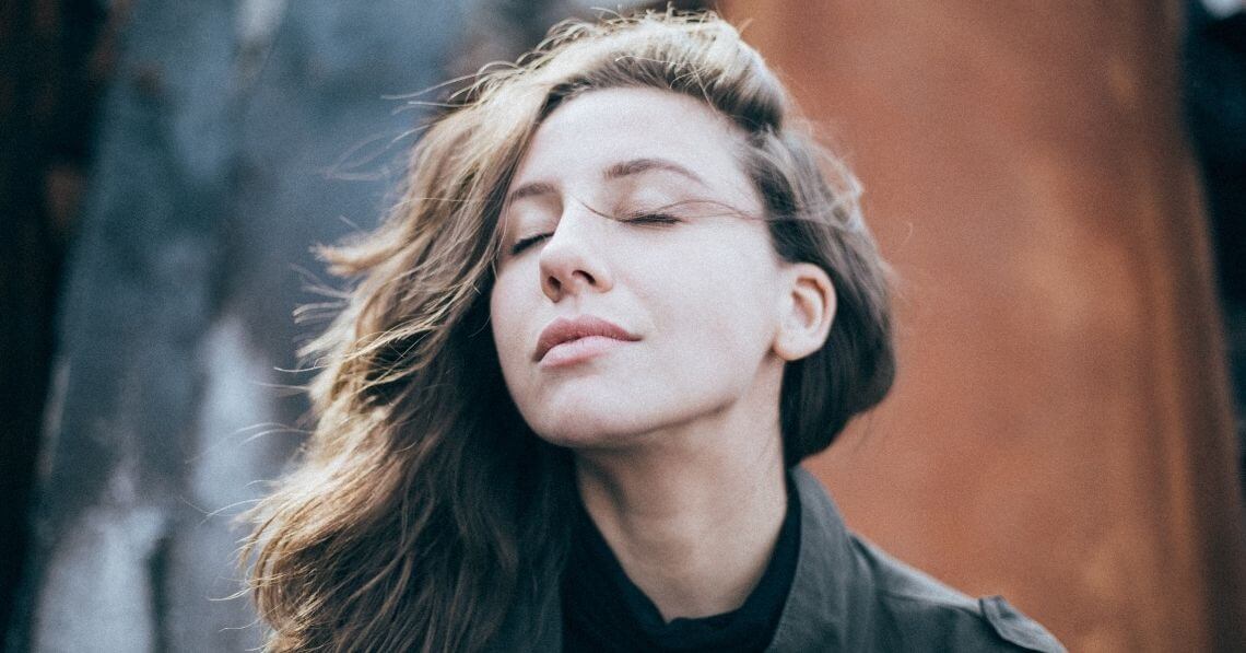 Young woman feeling the breeze