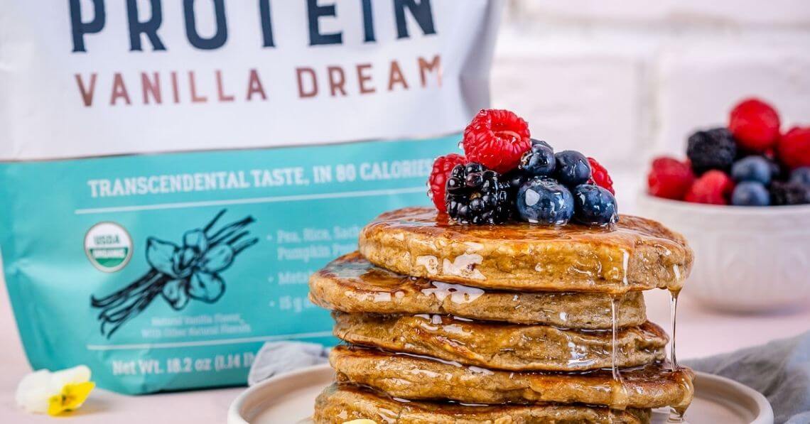 a stack of pancakes with blueberries on top