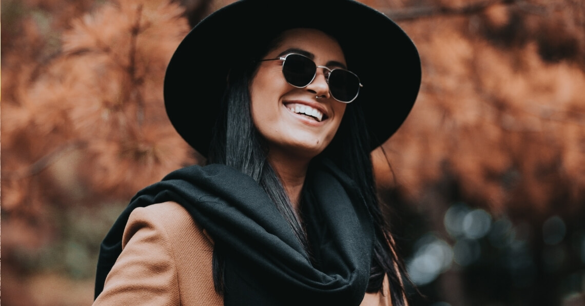 Young woman with radiant skin in fall