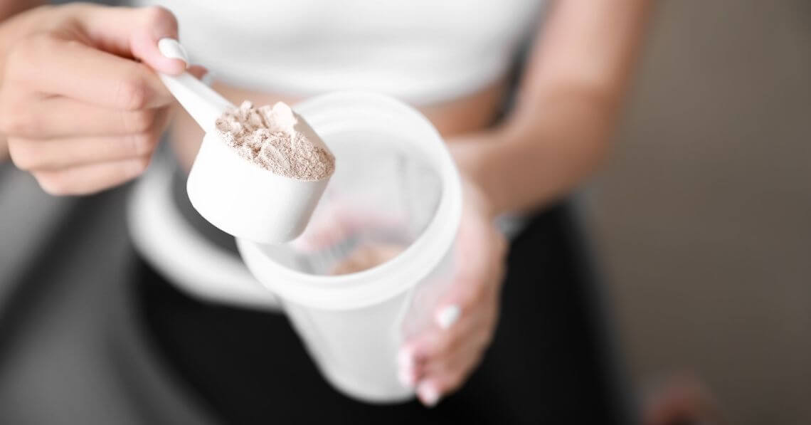 a person holding a cup of ice cream