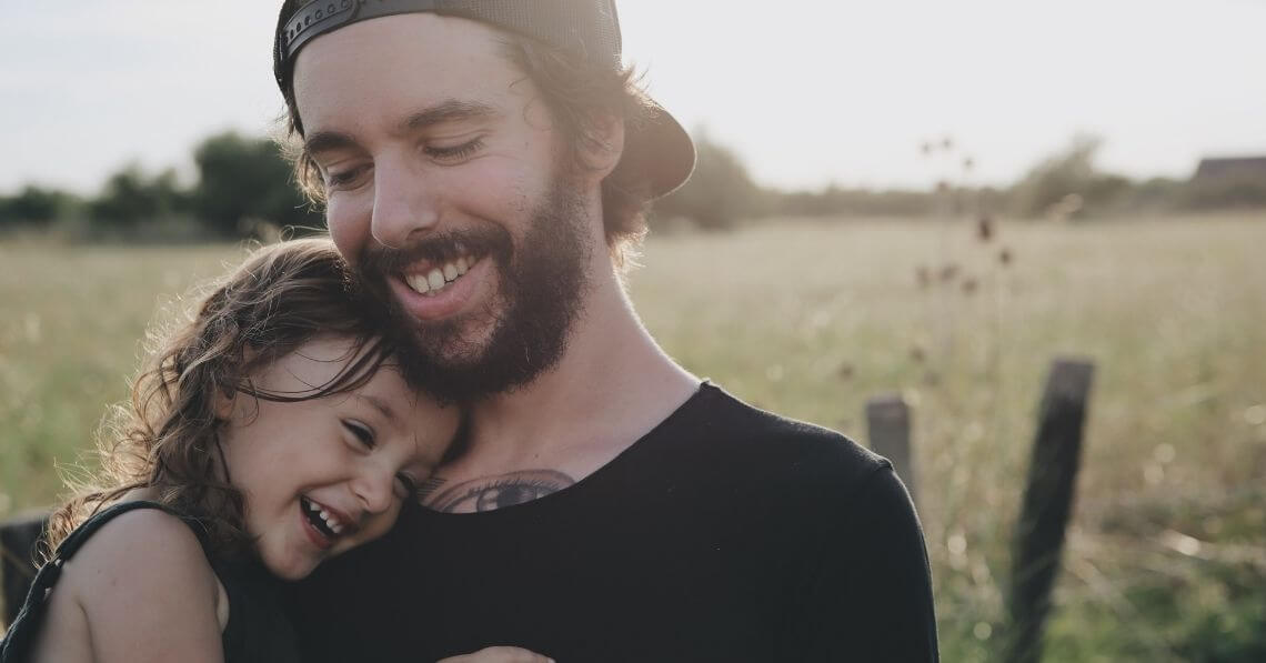 A father sharing a laugh with his daughter