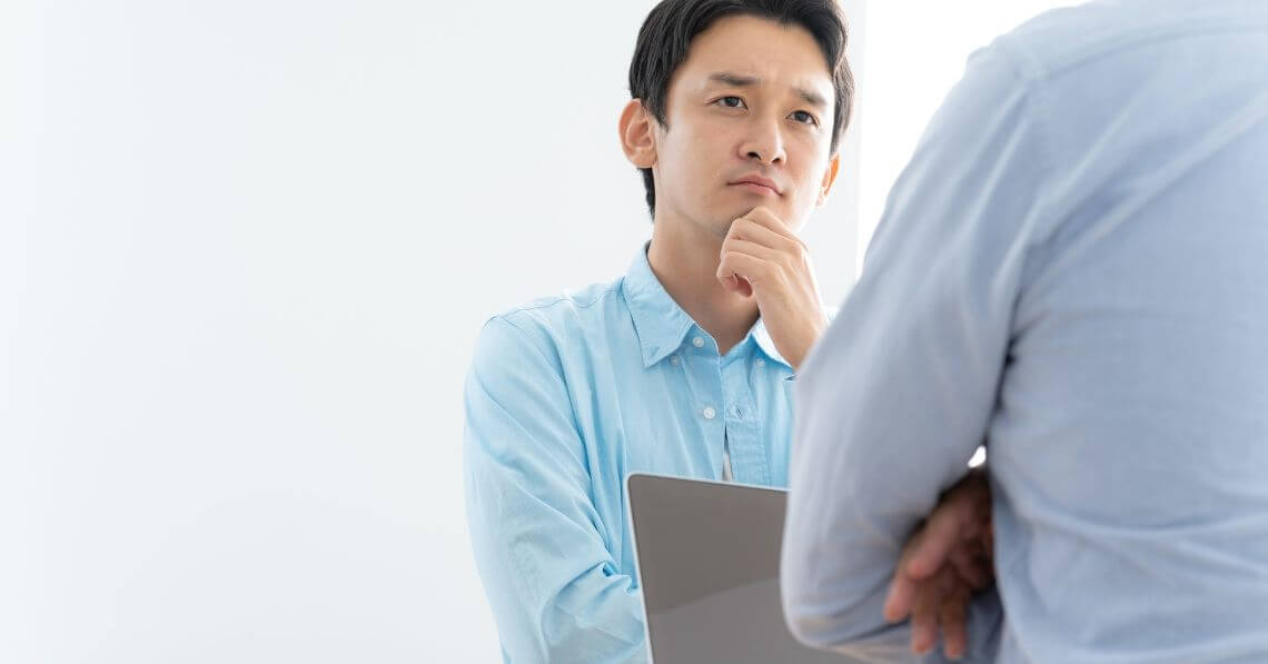 a person looking at a laptop