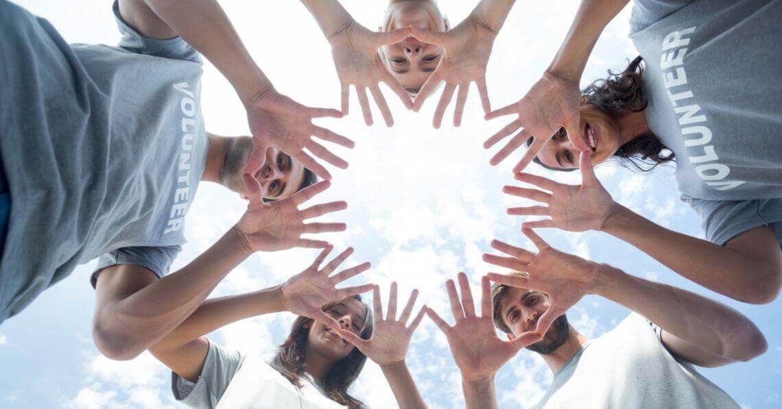 A group of people putting their hand together