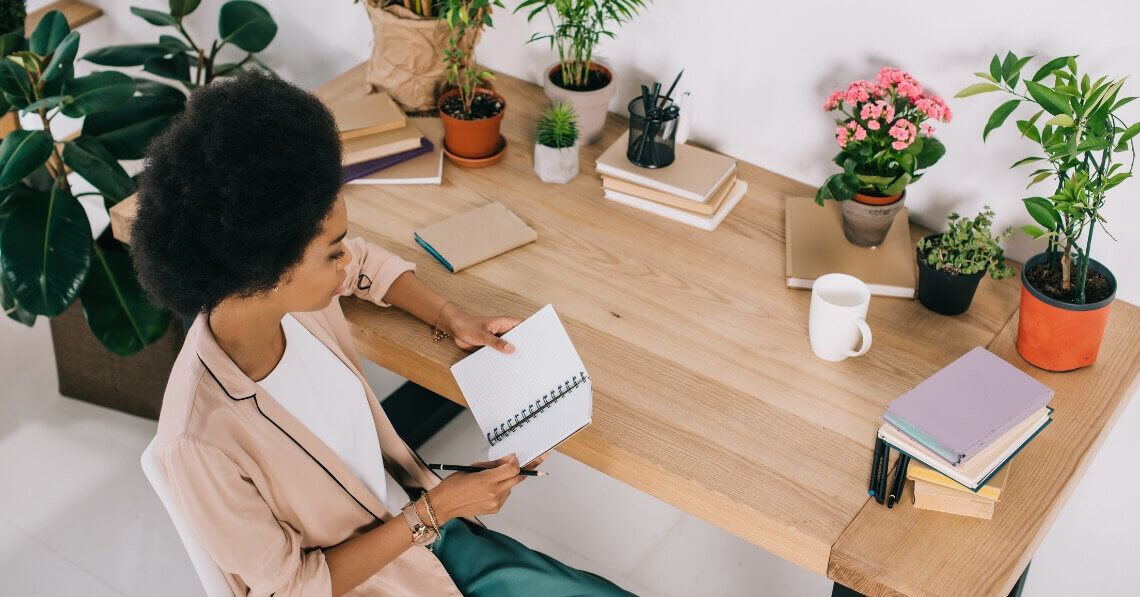 Young woman at her desk at work