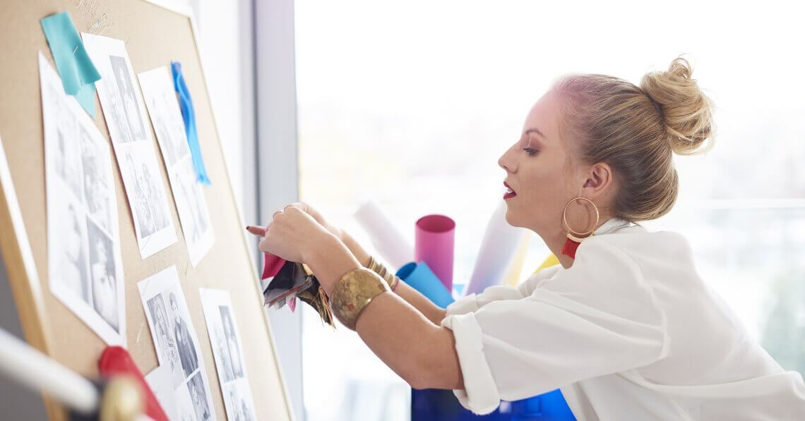 Woman organizing her pin board