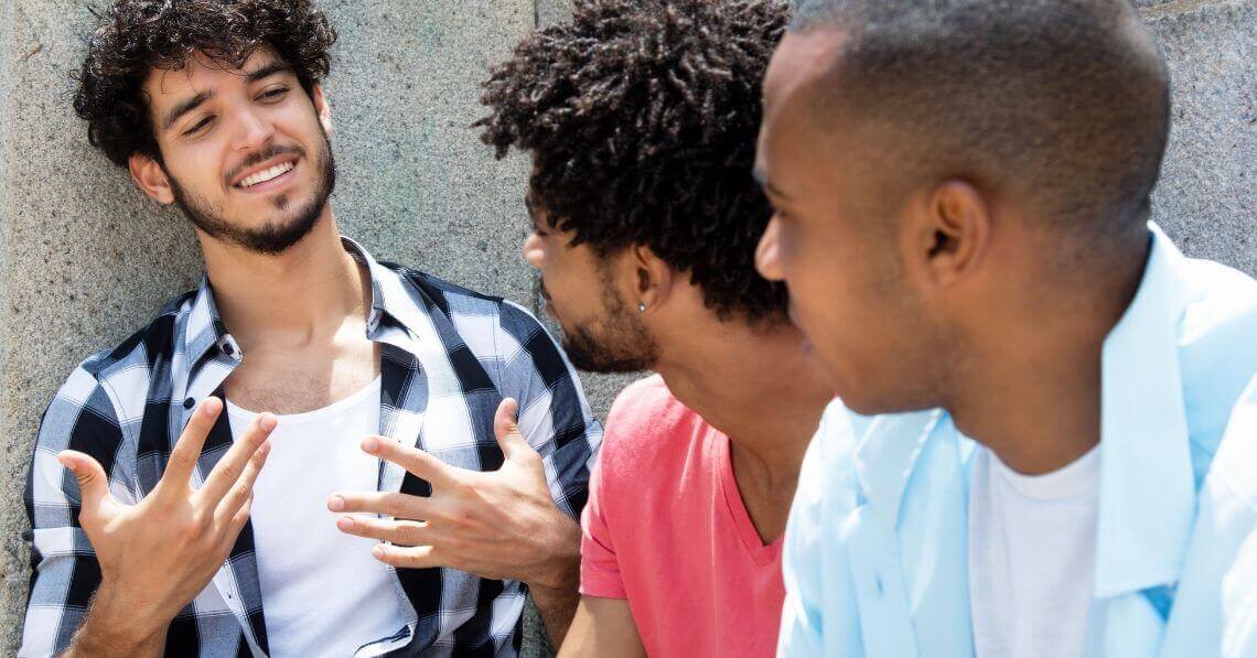 Two guys listening to their friend