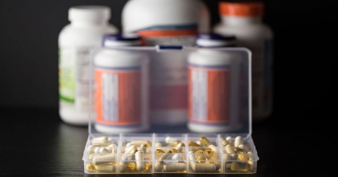 Supplement pills in a 5-day organizer