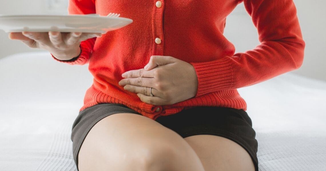 Woman after finishing her food on the plate