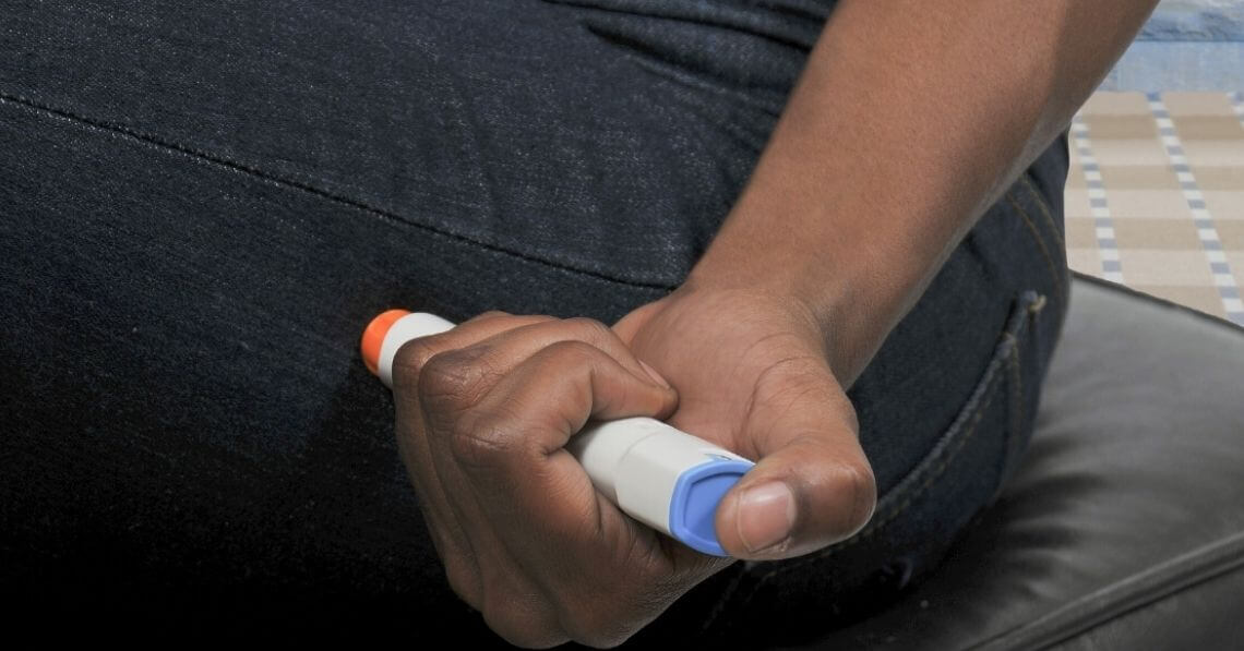 Man using epipen