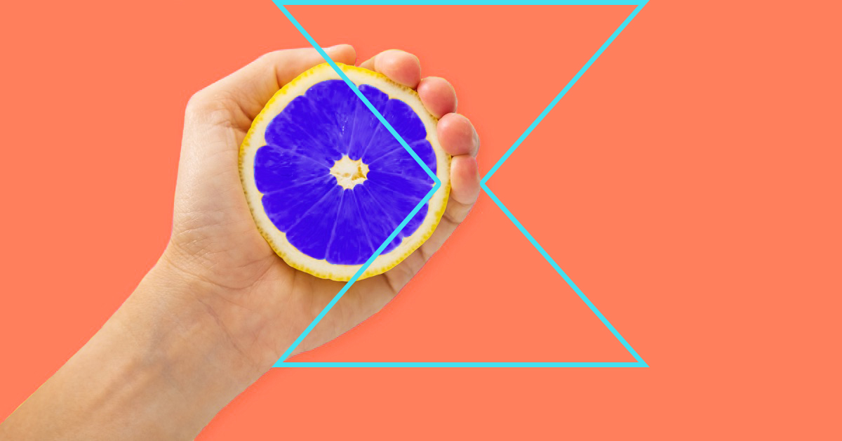person squeezing a lemon